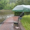 A bad day to discover that your brolly leaks! WiNe (Neil Williams) got wet at Stourton Junction on the Staffs & Worcs canal in May 2024