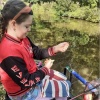 WoEv (Evelyn Woodhall) with one of several gudgeon that she caught in the National Celebration of Young People and Fishing at Shebdon on the Shropshire Union Canal in September 2022.